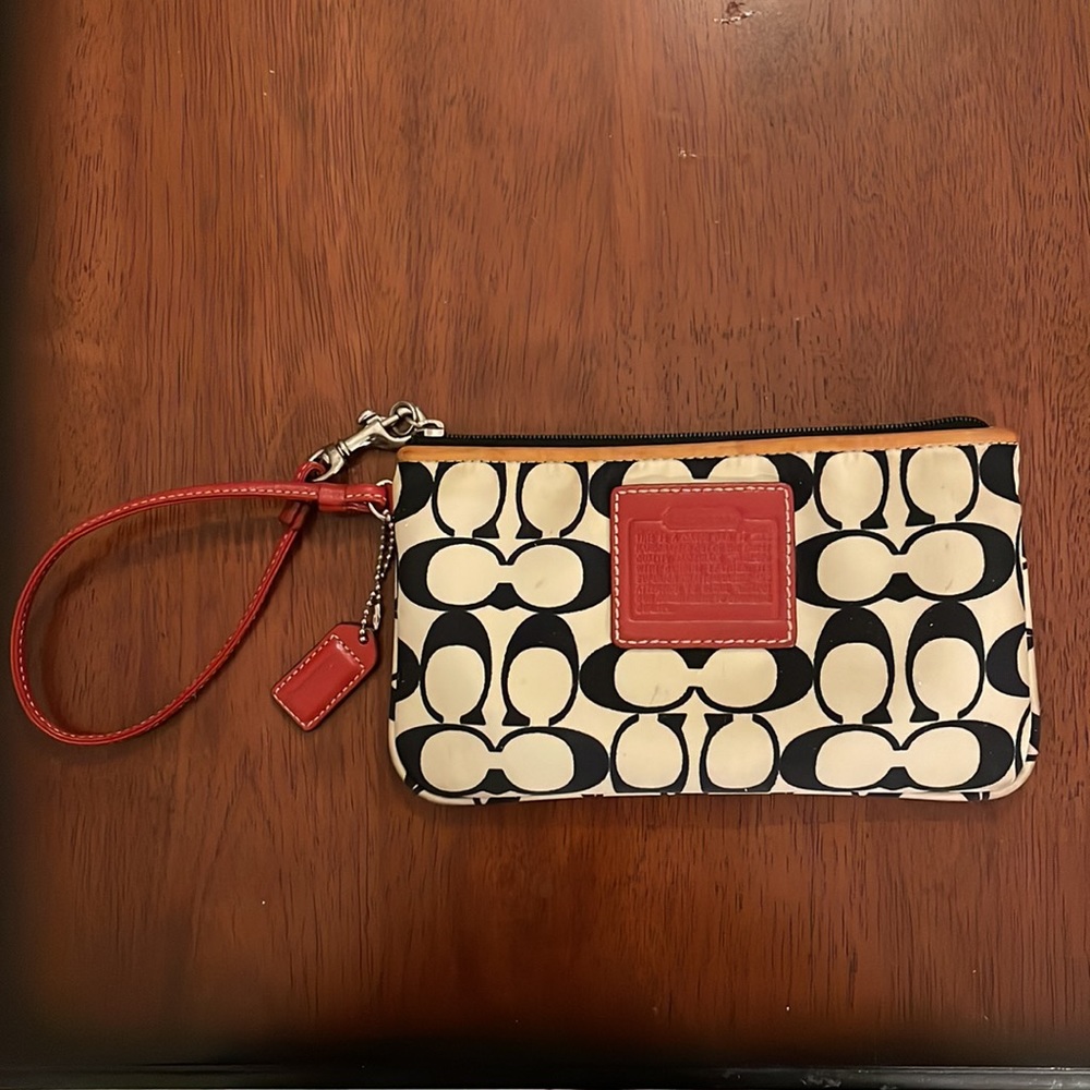 Black and white Coach wristlet